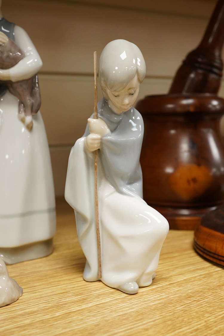 A group of twelve Lladro figures/animals, tallest 23cm